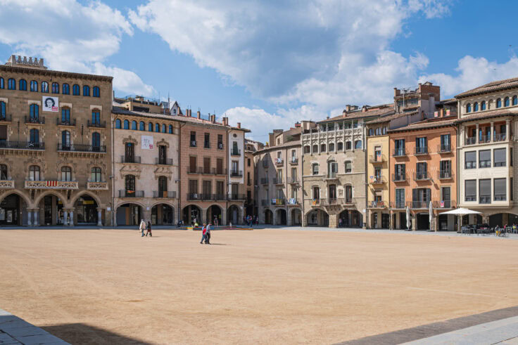 Tourists Walking In Plaça Major In Vic, Catalonia.