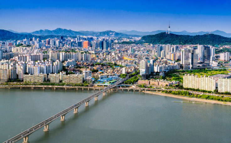 Aerial Shot Of Seoul City Skyline And N Seoul Tower With Traffic Bridge, South Korea.