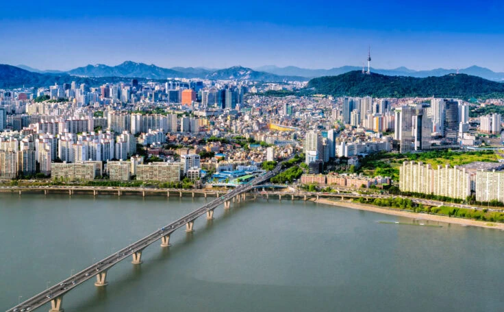 Aerial Shot Of Seoul City Skyline And N Seoul Tower With Traffic Bridge, South Korea.